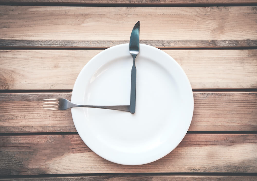 The evolution of mealtimes: why do we eat when we eat?